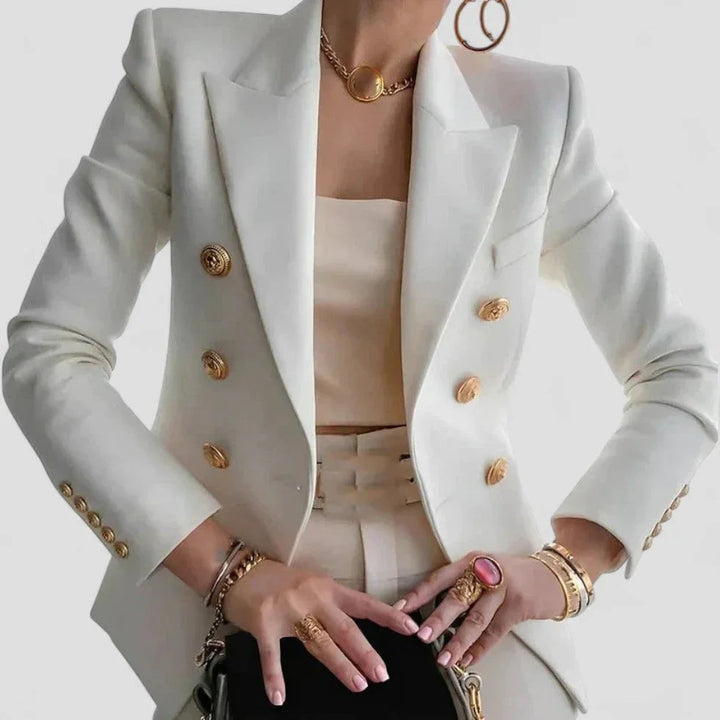 Elegant dame dobbeltspændt blazer med guldfarvede knapper, skræddersyet pasform og strukturerede skuldre.