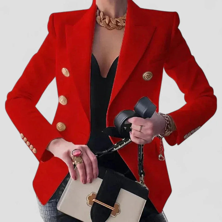 Elegant dame dobbeltspændt blazer med guldfarvede knapper, skræddersyet pasform og strukturerede skuldre.