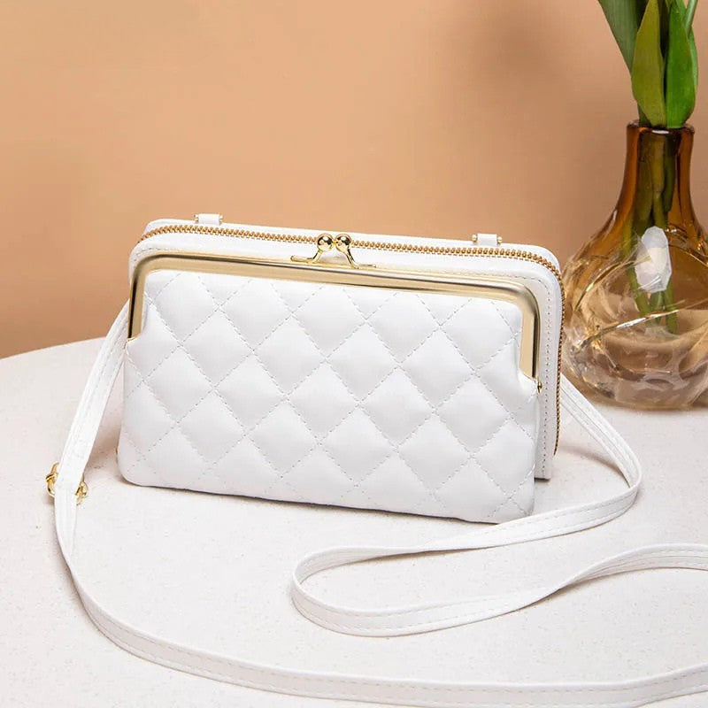 Elegant dame kompakt crossbody taske i vegansk læder i sort, med justerbar skulderrem og flere rum.