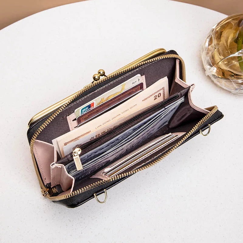 Elegant dame kompakt crossbody taske i vegansk læder i sort, med justerbar skulderrem og flere rum.