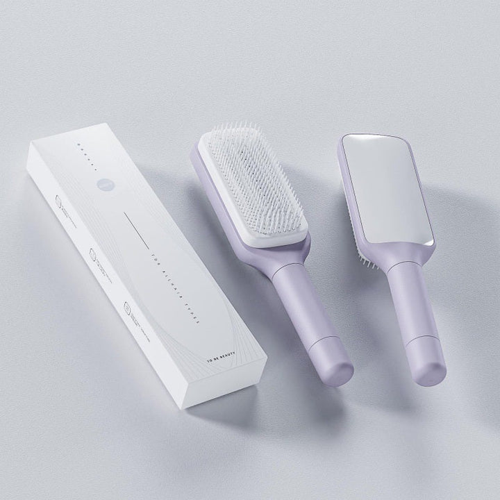 Unisex 4 in 1 itsepuhdistuva hiusharja, harmaa-violetti sävy, elegantti muotoilu, sopii kaikille hiustyypeille.