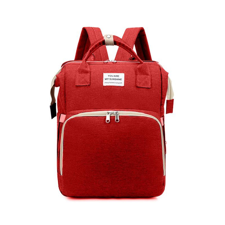 Unisex babyplejerep med seng, mange lommer til babyudstyr, foldet sammen, gråt Oxford-stof.