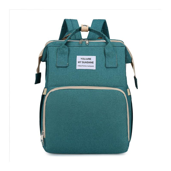 Unisex babyplejerep med seng, mange lommer til babyudstyr, foldet sammen, gråt Oxford-stof.