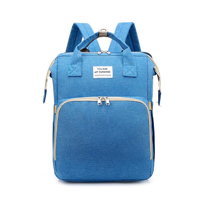 Unisex babyplejerep med seng, mange lommer til babyudstyr, foldet sammen, gråt Oxford-stof.