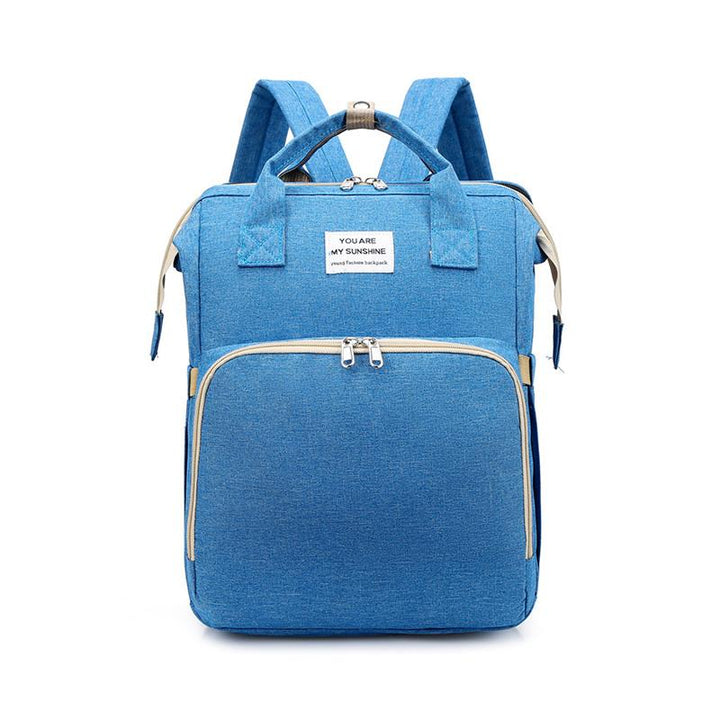 Unisex babyplejerep med seng, mange lommer til babyudstyr, foldet sammen, gråt Oxford-stof.