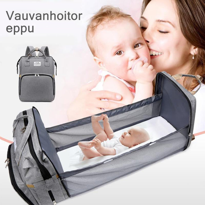Unisex babyplejerep med seng, mange lommer til babyudstyr, foldet sammen, gråt Oxford-stof.