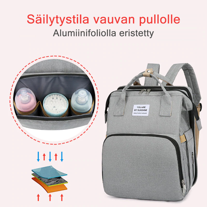 Unisex babyplejerep med seng, mange lommer til babyudstyr, foldet sammen, gråt Oxford-stof.