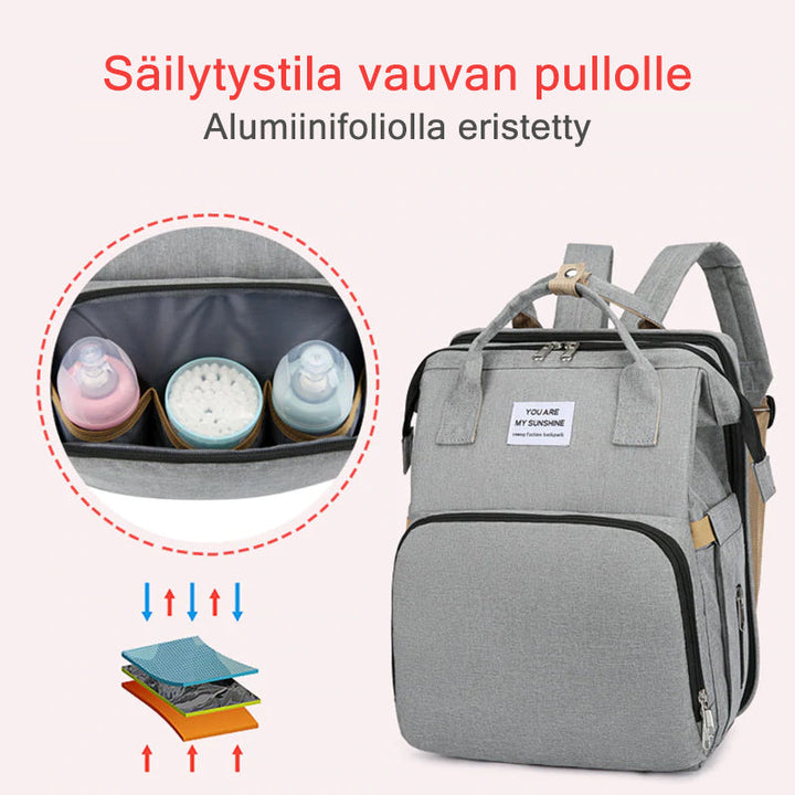 Unisex babyplejerep med seng, mange lommer til babyudstyr, foldet sammen, gråt Oxford-stof.