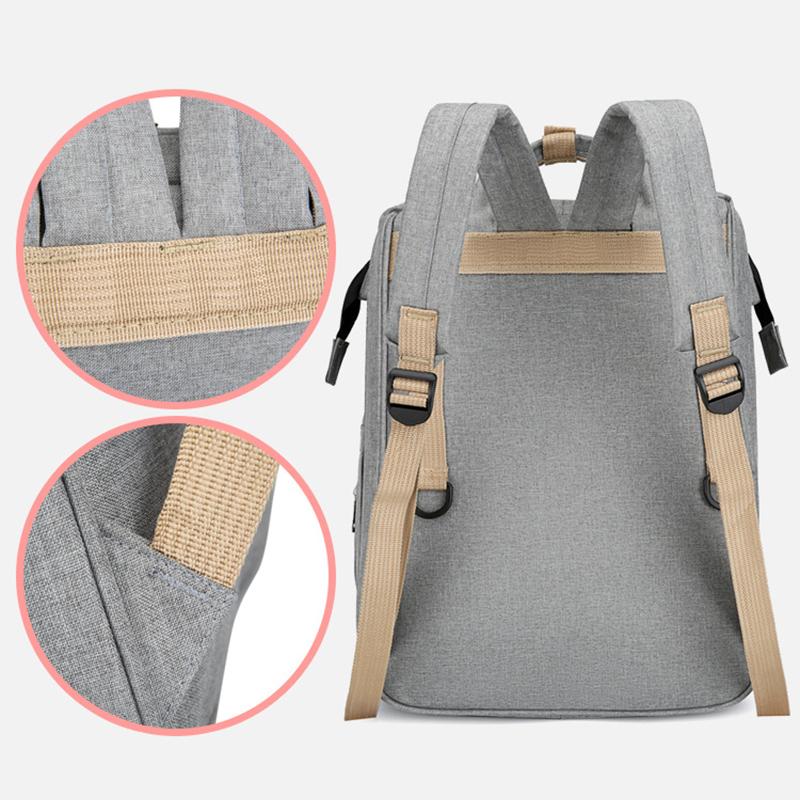 Unisex babyplejerep med seng, mange lommer til babyudstyr, foldet sammen, gråt Oxford-stof.