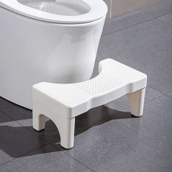 Universel toiletsskammel, minimalistisk grå, gul, blå og hvidt design, kompakt størrelse til badeværelset.