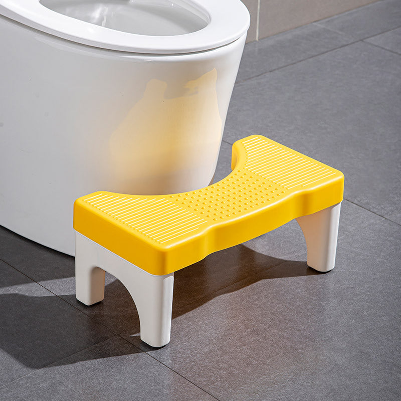Universel toiletsskammel, minimalistisk grå, gul, blå og hvidt design, kompakt størrelse til badeværelset.
