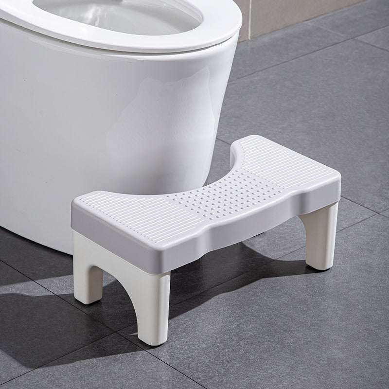 Universel toiletsskammel, minimalistisk grå, gul, blå og hvidt design, kompakt størrelse til badeværelset.