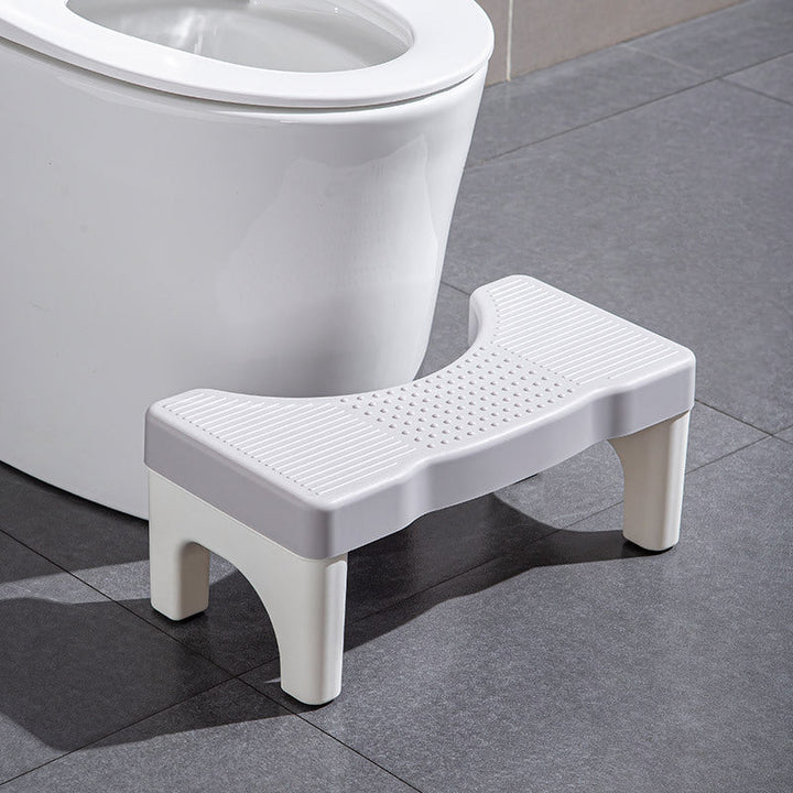 Universel toiletsskammel, minimalistisk grå, gul, blå og hvidt design, kompakt størrelse til badeværelset.