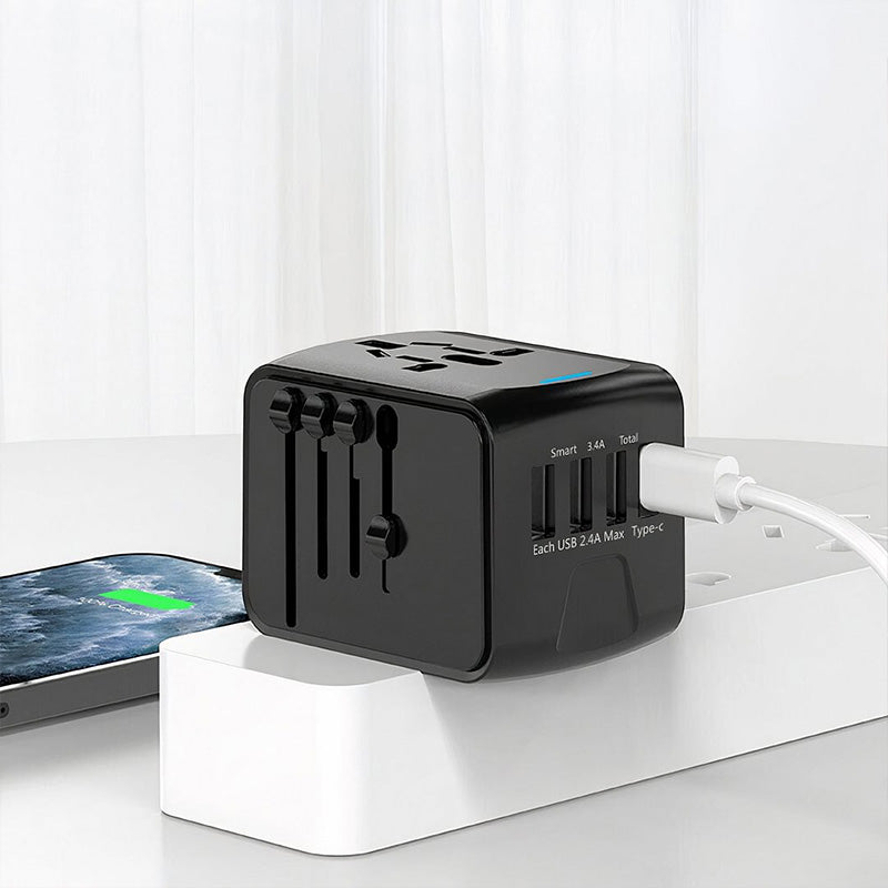"Universaali matkapistokeadapteri 4 USB-portilla, musta, tukee US, UK, EU, AU pistokkeita, kompakti ja kannettava, elektronii