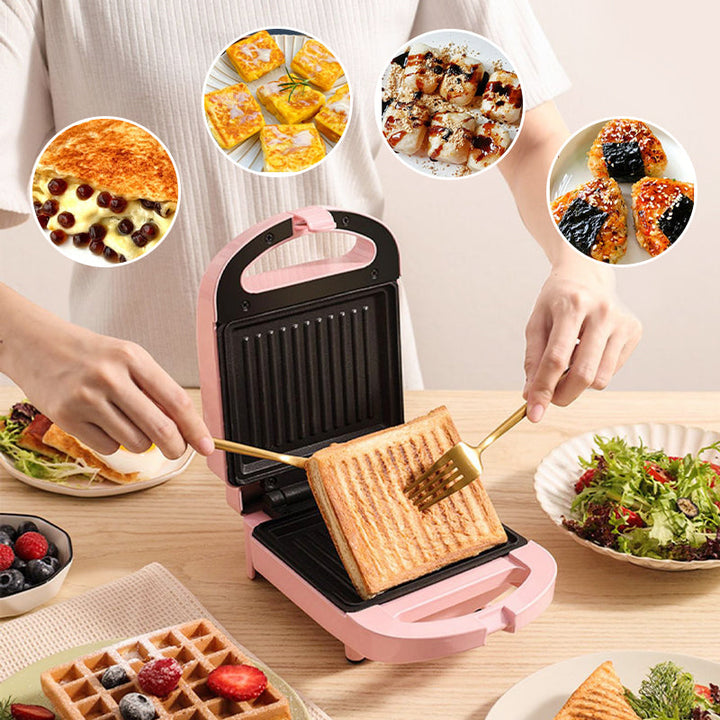Pink og rød multifunktionel morgenmadsgrill, kompakt og pladsbesparende til køkkenet, velegnet til stegning og grillning