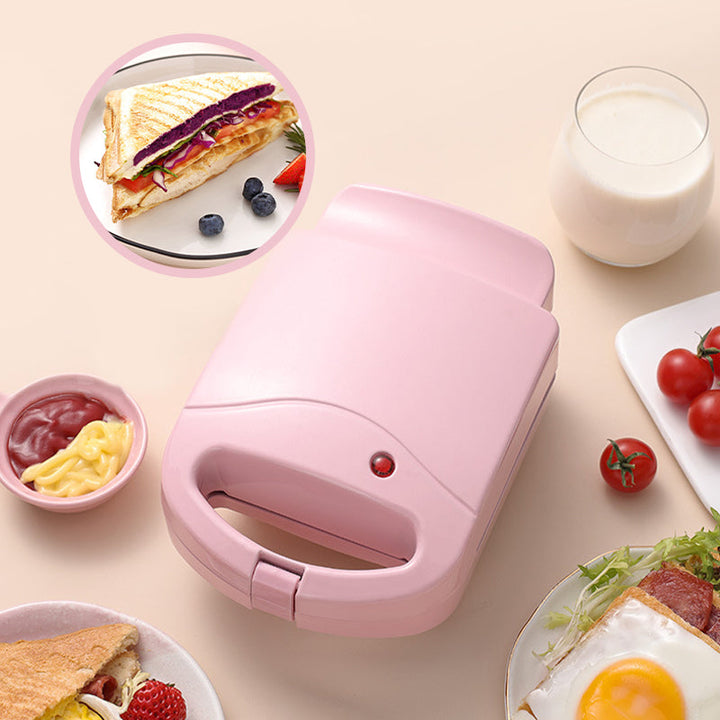 Pink og rød multifunktionel morgenmadsgrill, kompakt og pladsbesparende til køkkenet, velegnet til stegning og grillning