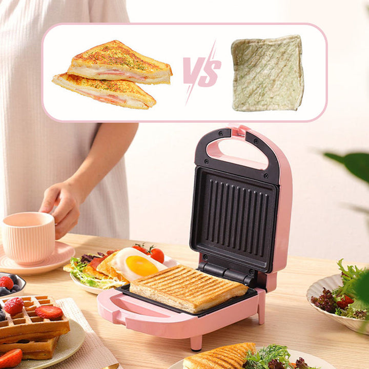 Pink og rød multifunktionel morgenmadsgrill, kompakt og pladsbesparende til køkkenet, velegnet til stegning og grillning