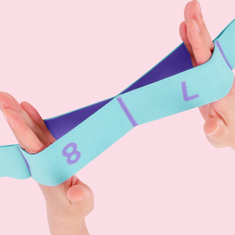 Pink og blå modstandsdygtig elastik med flere løkker til fleksibilitetstræning, forbedrer kropskontrol.