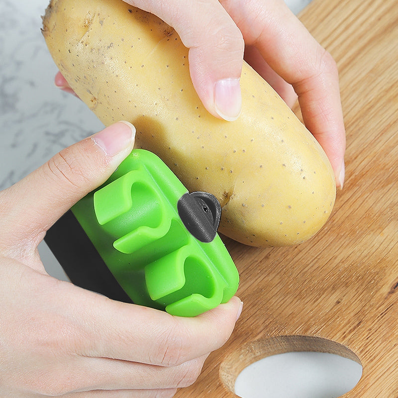 Grøn tommer-skræller til frugt og grønt, ergonomisk design, lyse farver, klinge i rustfrit stål