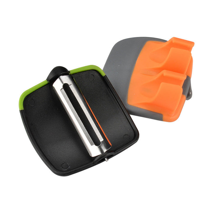 Grøn tommer-skræller til frugt og grønt, ergonomisk design, lyse farver, klinge i rustfrit stål