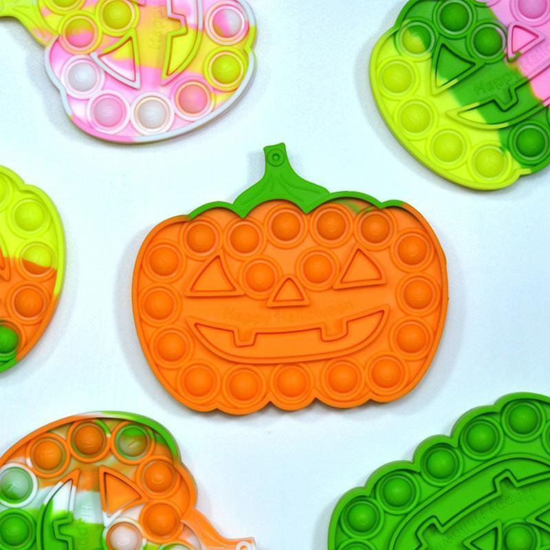Farverigt Halloween Pop-it legetøj til børn, med orange, grønne og lyserøde bobler til at trykke.