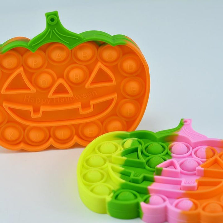 Farverigt Halloween Pop-it legetøj til børn, med orange, grønne og lyserøde bobler til at trykke.