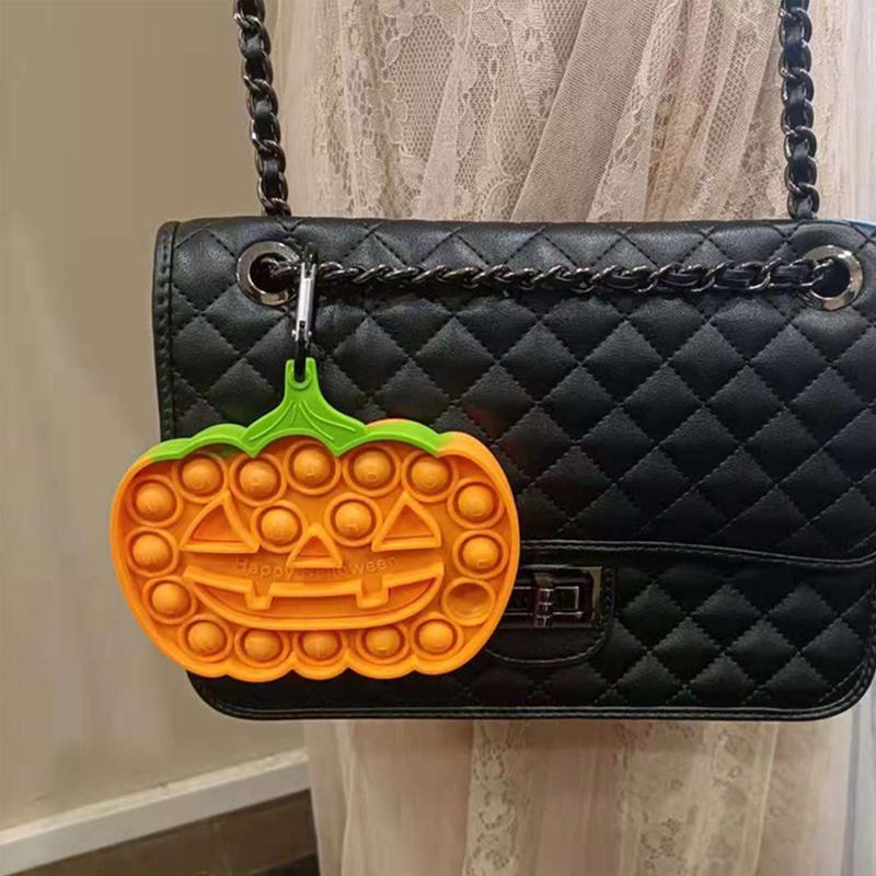 Farverigt Halloween Pop-it legetøj til børn, med orange, grønne og lyserøde bobler til at trykke.