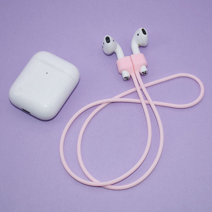 Multifarvet magnetisk Airpods-halsrem i silikone, tilgængelig i fire farver: mint, sort, pink og hvid.