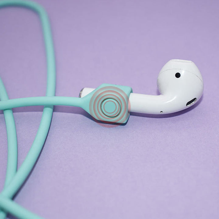 Multifarvet magnetisk Airpods-halsrem i silikone, tilgængelig i fire farver: mint, sort, pink og hvid.