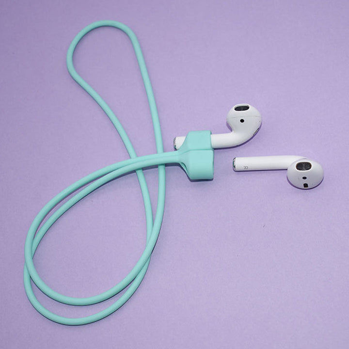 Multifarvet magnetisk Airpods-halsrem i silikone, tilgængelig i fire farver: mint, sort, pink og hvid.