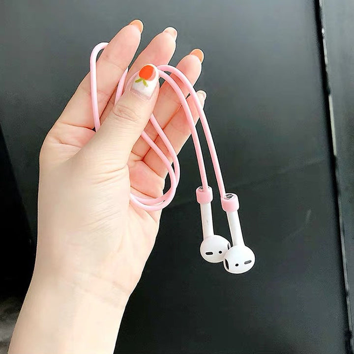 Multifarvet magnetisk Airpods-halsrem i silikone, tilgængelig i fire farver: mint, sort, pink og hvid.