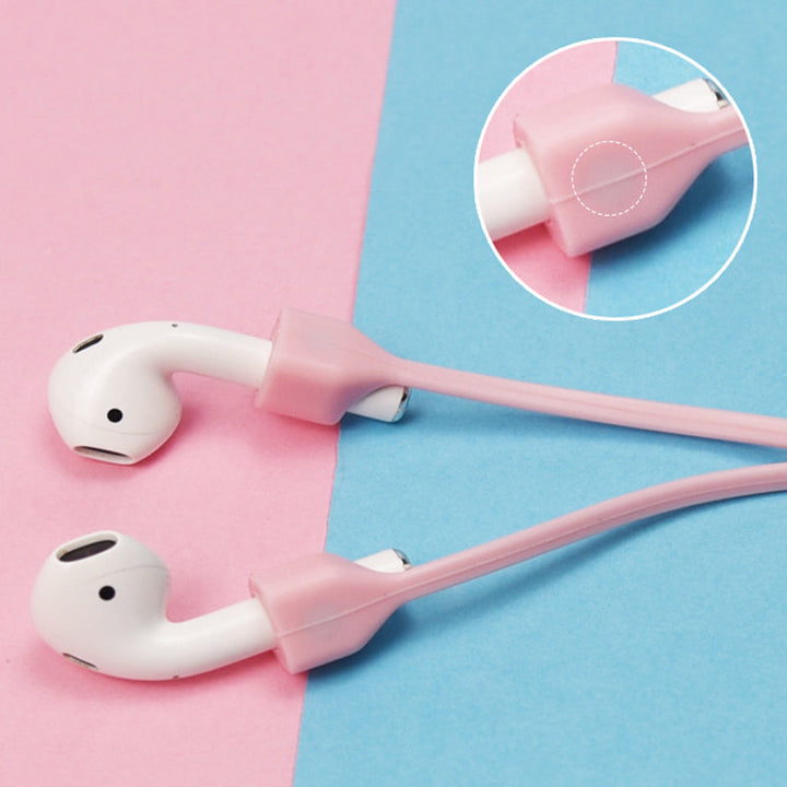 Multifarvet magnetisk Airpods-halsrem i silikone, tilgængelig i fire farver: mint, sort, pink og hvid.