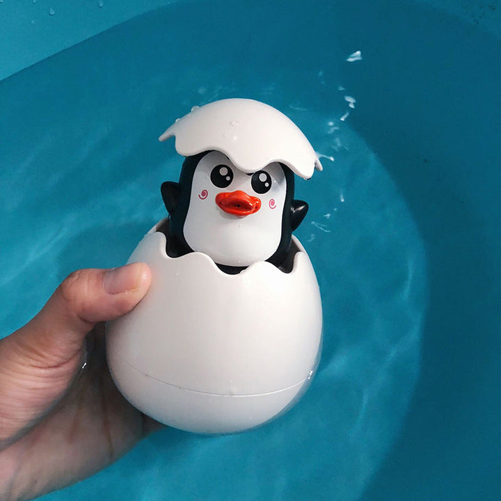 Farverigt babylegetøj til badetid, med gule andeæg og blå dinosauræg, der bringer glæde i badet.