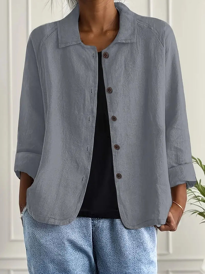 Ensfarvet damejakke, moderne design med knapper for en chic hverdags look. Komfortabel.