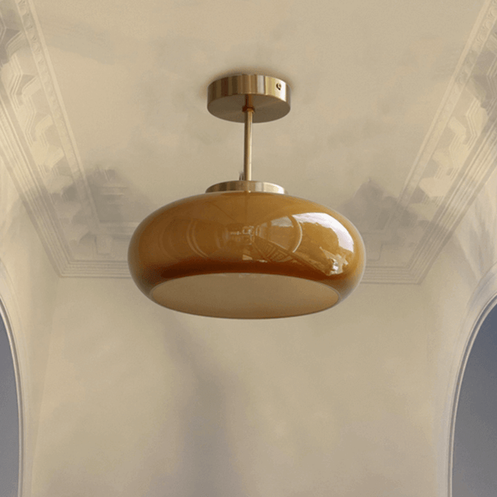 Vintage loftslampe med orange glaskuppel og kobberstel