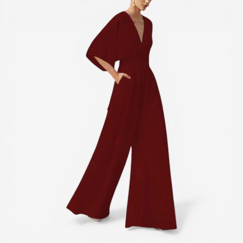 Løs dame jumpsuit med v-hals, perfekt til hverdagsbrug, stilfuld og yderst komfortabel.