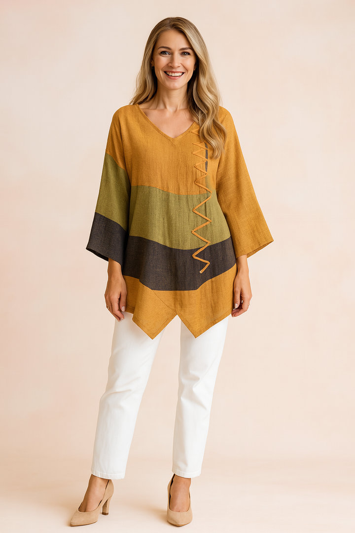 Stilfuld dame tunika i asymmetrisk design med unikke detaljer. En moderne kvinde bluse til hverdag og fest.