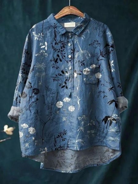 Smart kontorbluse med blomsterprint og feminine detaljer, giver et professionelt look.