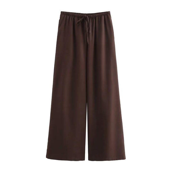 Elegant pantsuit-inspireret sæt med vide ben og løs pasform, til den modebevidste kvinde.