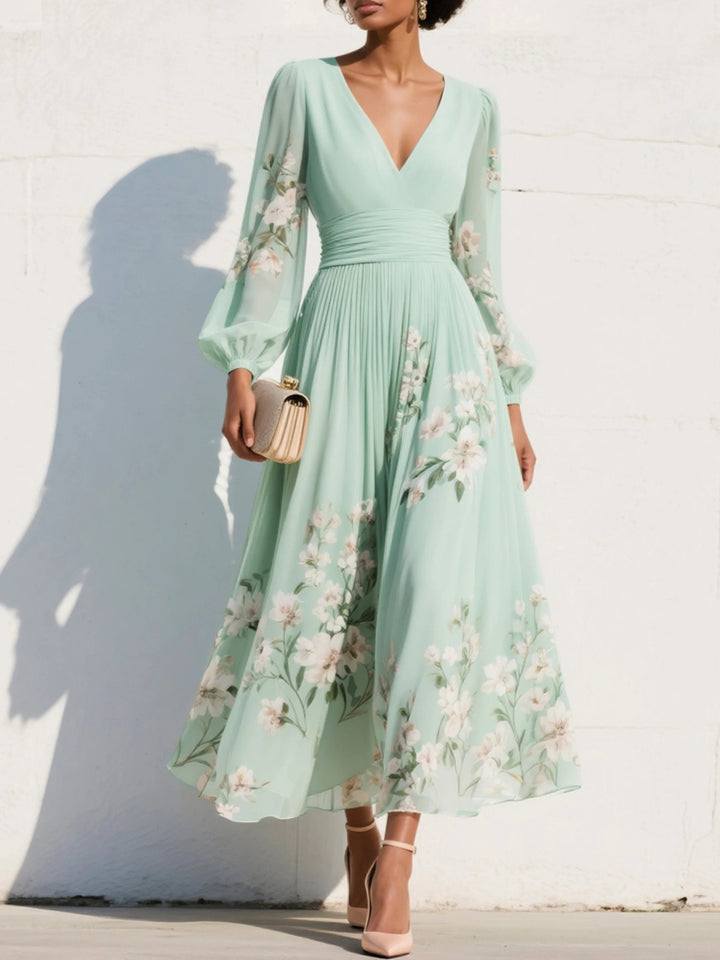 Elegant lysegrøn blomster midi-kjole med V-hals, ballonærmer. Perfekt festkjole til sommerbryllup.