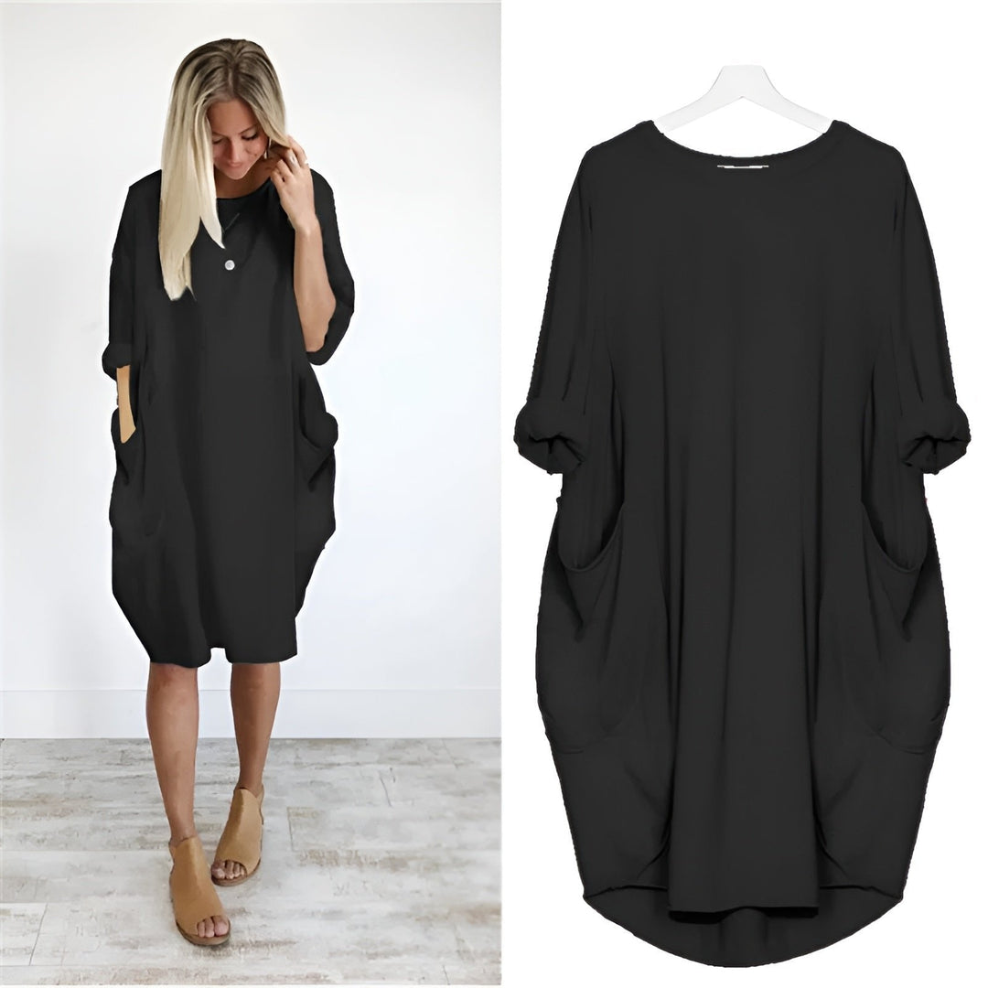 Elegant plus size damekjole med lommer og løs pasform. Komfortabel hverdagskjole til kvinder.