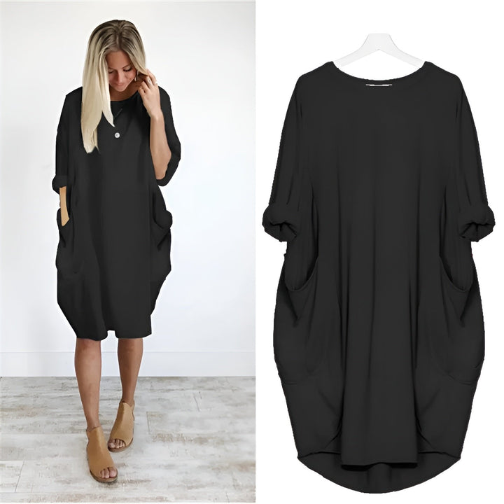 Elegant plus size damekjole med lommer og løs pasform. Komfortabel hverdagskjole til kvinder.
