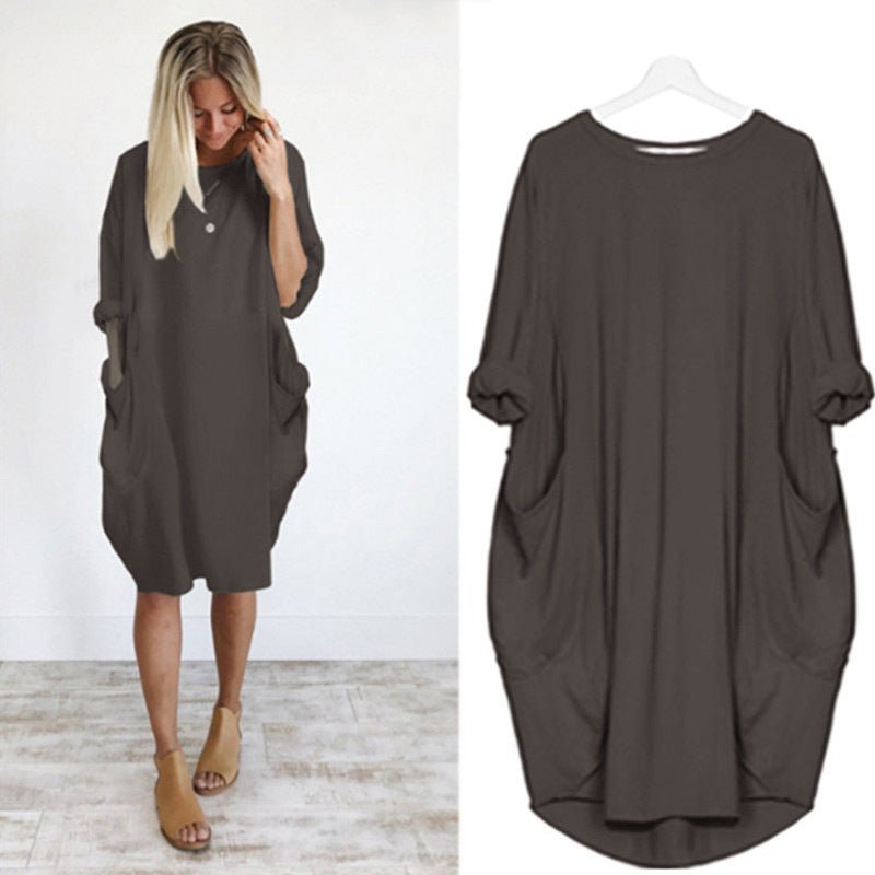 Komfortabel plus size damekjole med lommer. Løs pasform og elegant design til hverdagsbrug.