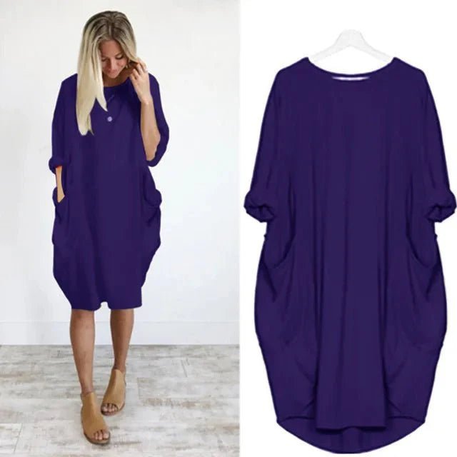 Stilfuld plus size kjole med trekvart ærmer. Komfortabel løs pasform og praktiske lommer.