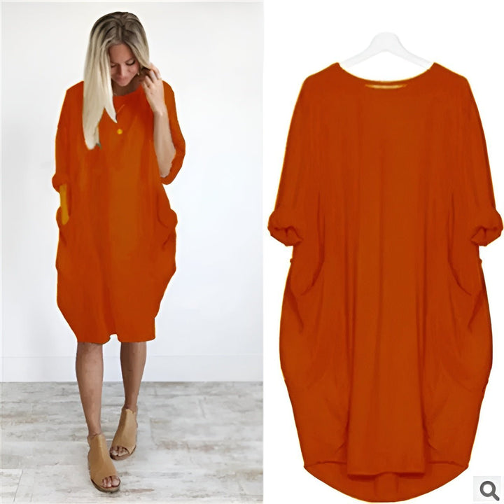 Alsidig plus size damekjole med rund hals, trekvart ærmer og lommer. Elegant, komfortabel og løs.