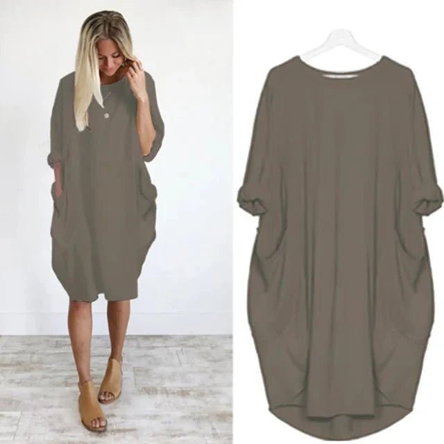 Alsidig plus size kjole med praktiske lommer. Løs pasform for optimal komfort og bevægelsesfrihed.