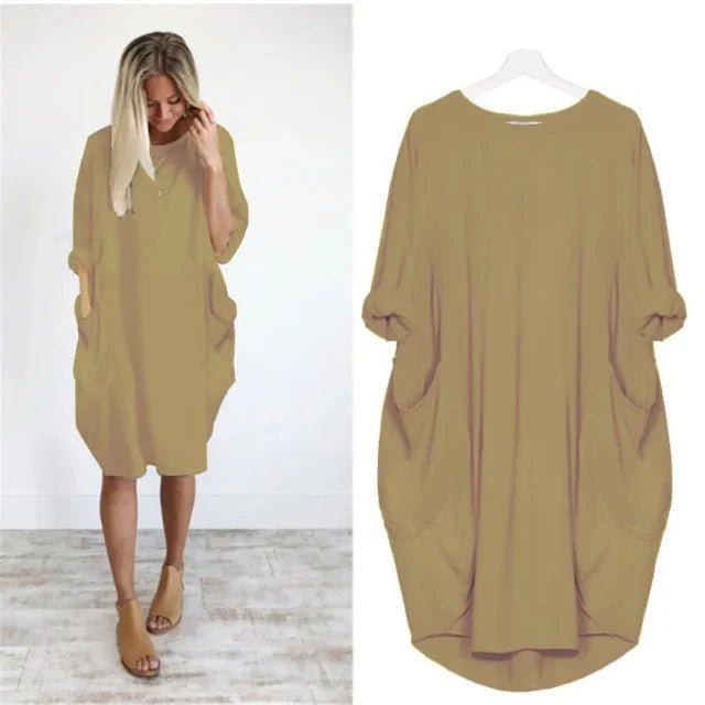 Smart plus size kjole til kvinder med funktionelle lommer. Løs pasform og stilfuldt design.