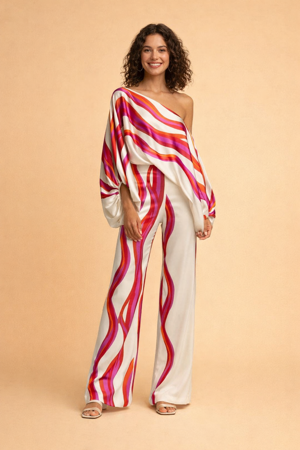 Elegant todelt sommersæt til damer med off-shoulder top og vide ben. Mønstret, komfortabelt design.