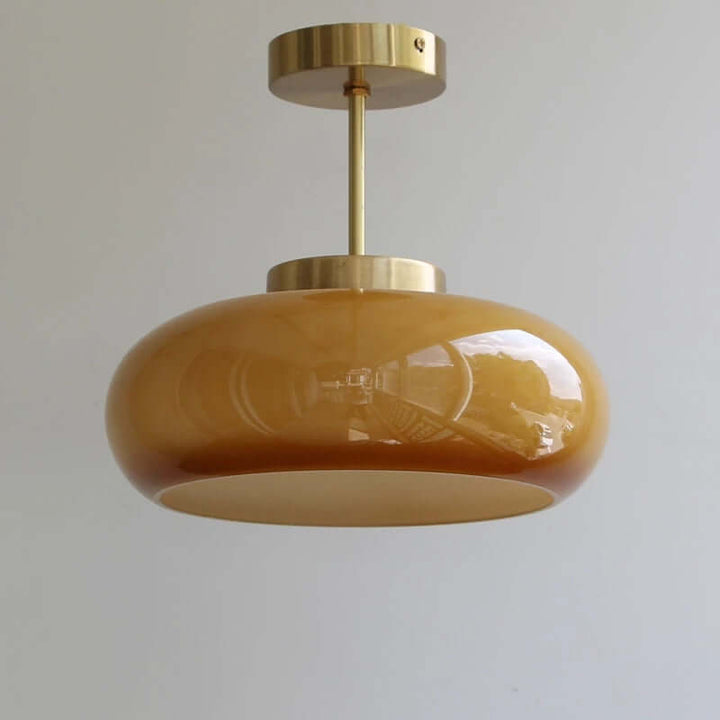 Vintage loftslampe med orange glaskuppel og kobberstel