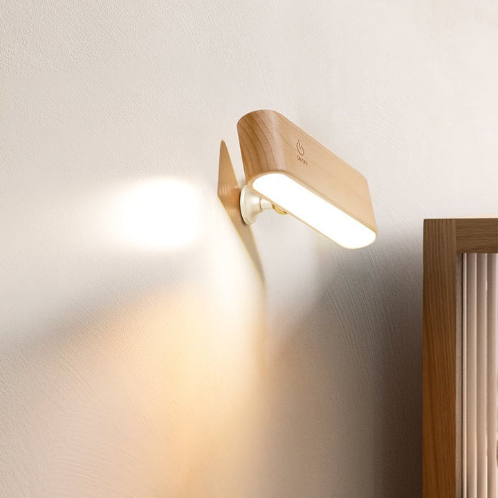 Stilfuld trådløs natlampe/stemningslys i valnødtræ med magnetisk 360° rotation.